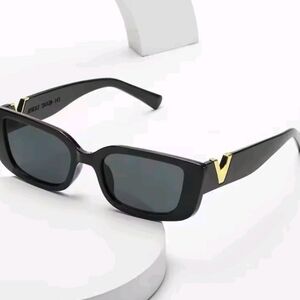 Stylish Black Sunglasses with Gold Accent